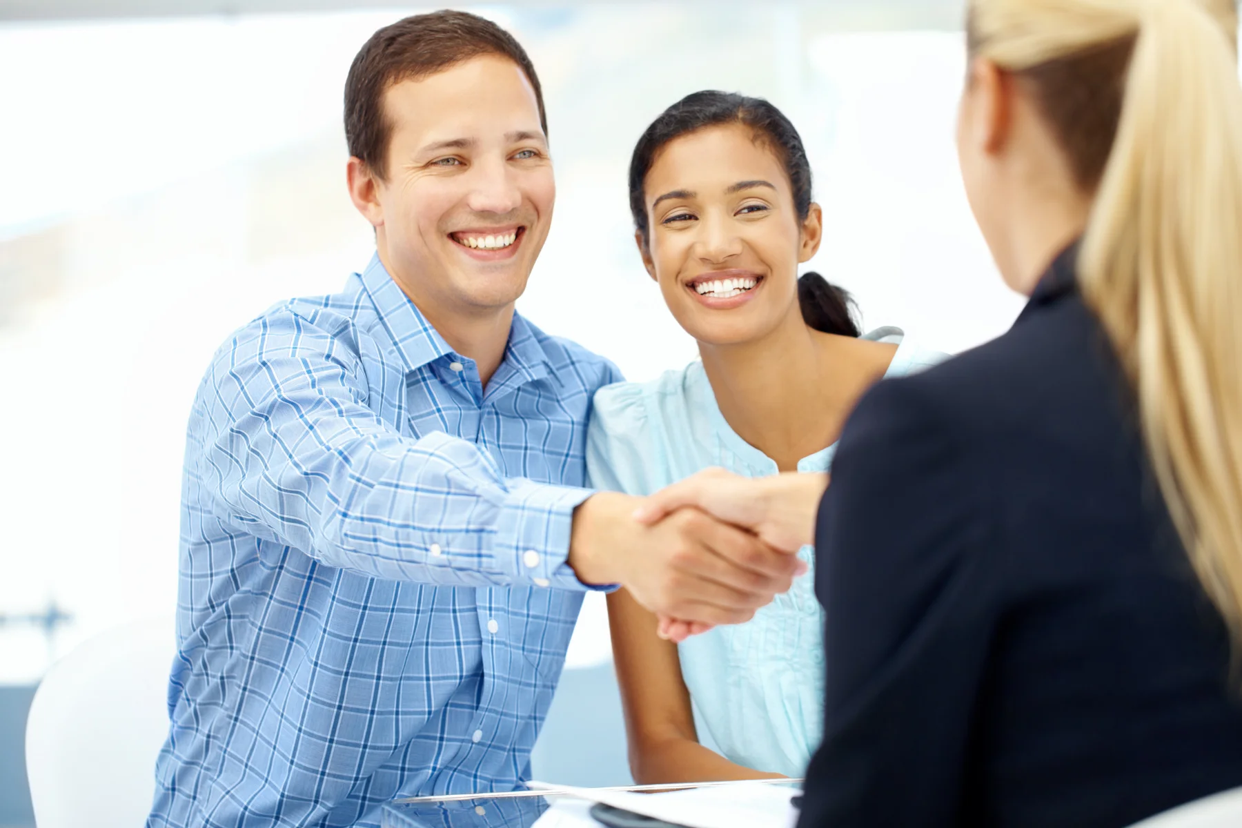 Man and woman smiling after loan approval