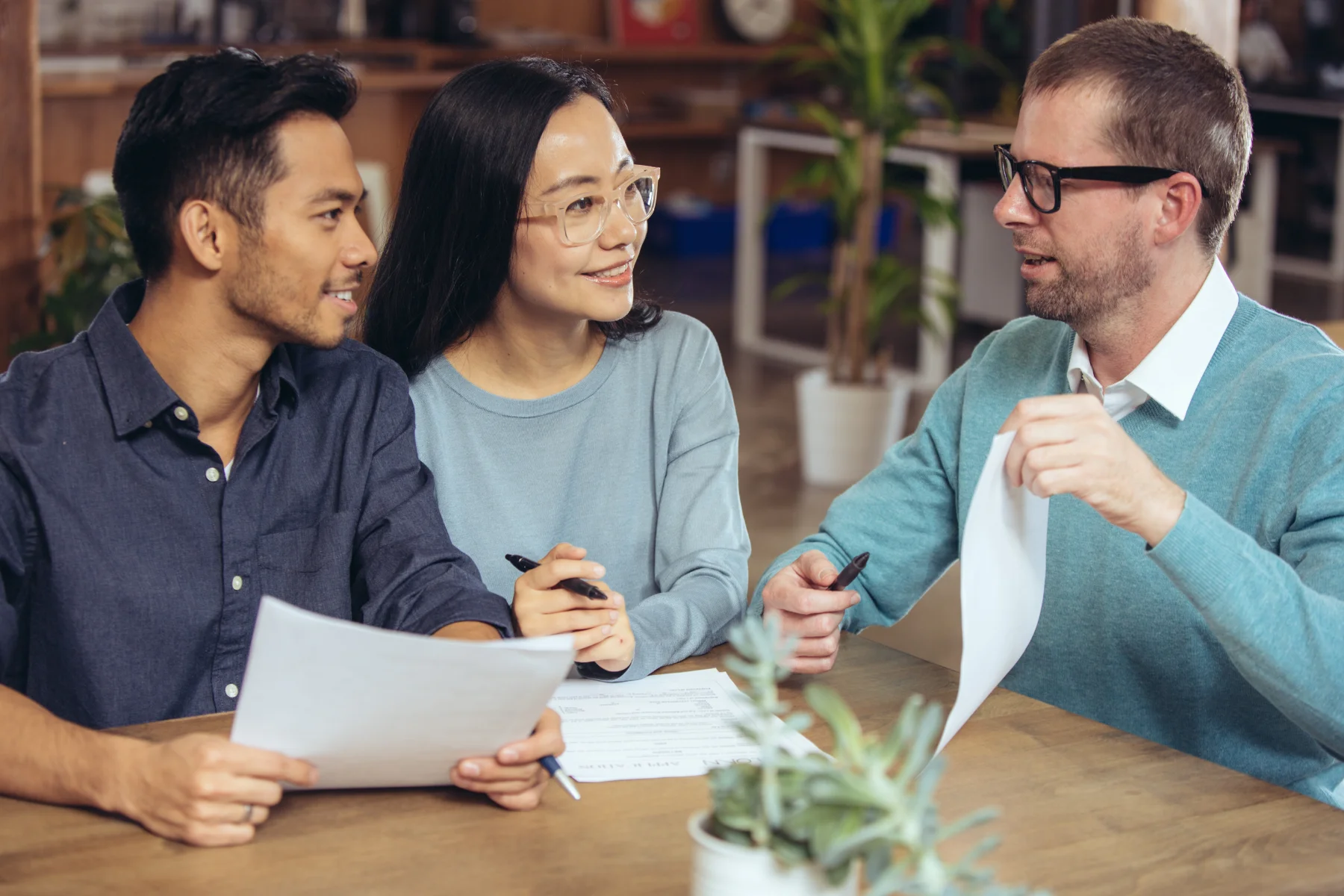Young couple checking loan agreement